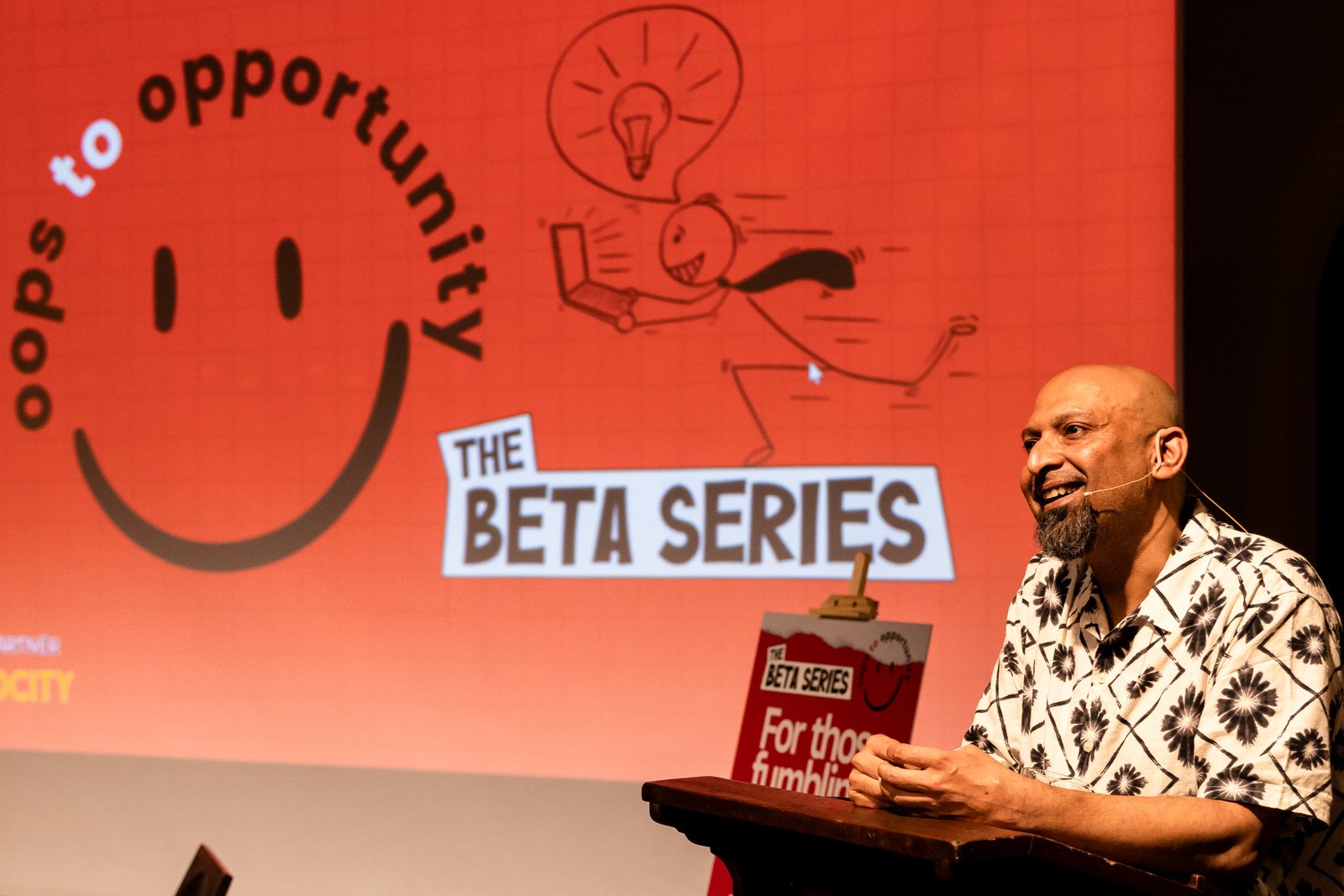 A speaker on stage at the first Beta Series.